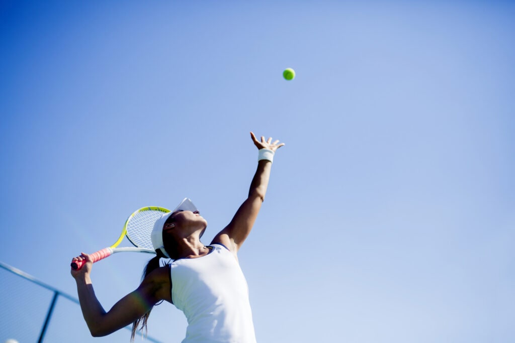 young girl playing tennis